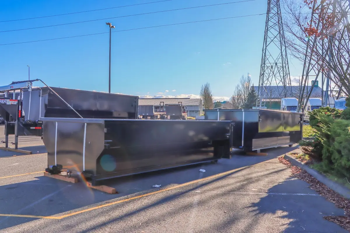 Roll-off dumpster ready for waste disposal at job site for Demolition Dumpster Rental in Queensbury